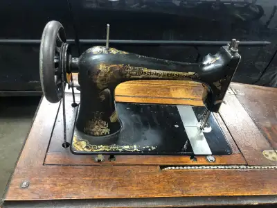 Vintage/antique retro mid-century treadle sewing machine in cabinet. Foot pedal. At least 100 years...