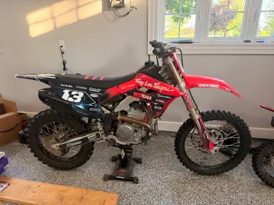 Near show room condition 2024 honda crf250 rx (1 imperfection of a minor dint in the exhaust header)...