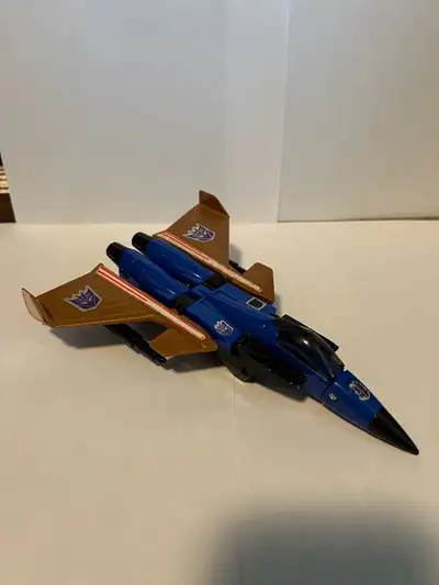 Transformers G1 Dirge, missing fists and landing gear. Stickers are decent, displays in jet or robot...