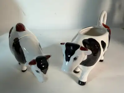 Add charm to your morning coffee routine or farmhouse kitchen display with this adorable ceramic cow...