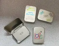 Assorted hand stamped metal gift card tins with attached lids
