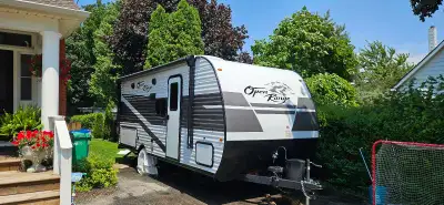 24ft Trailer with slide out. It is in great condition. Queen bed folds into couch, table can be used...