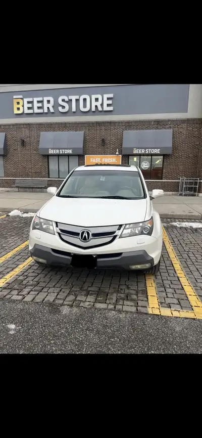 2009 Acura MDX Tech Package Beige leather interior 3 row seating Heated seats in front and rear Back...