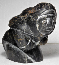 Inuit soapstone sculpture carving BOWING WOMAN by Thomas Akilak