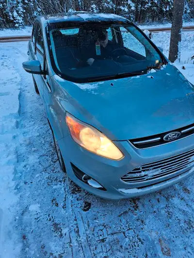 2013 Ford C Max hybrid. Drives well, in great shape for its age. Little rust near back wheel. Has ba...