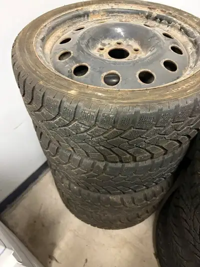 Set of 4, Very Low Kilometers on these Low Profile Directional winter tires mounted on steel rims, b...
