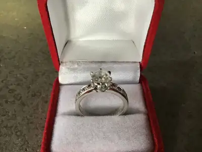 Never worn, very white and brilliant 1.12 carat diamond engagement ring with excellent cut. This is...