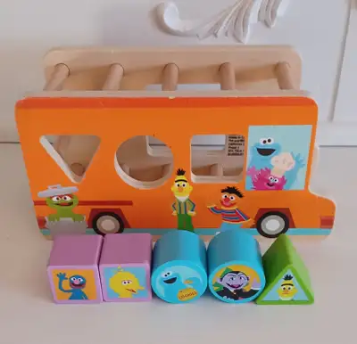 This pre-loved, wooden, Bright Starts Foodie Truck is also a shape sorter. It has Sesame Street char...