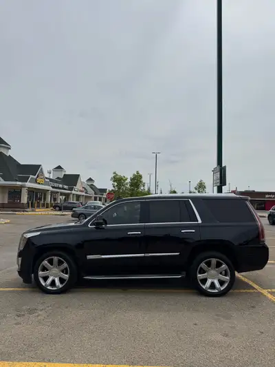 If your looking for a nice and clean Escalade, this is it! It’s black outside on black interior with...