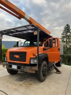 2006 GMC 7500 Topkick Bucket/Boom truck with chip box and tool compartments. Kubota Pony motor with...