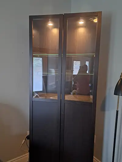 Selling for my mother: Storage Cabinet 2 glass shelves with storage below inside light 79x31x12 inch...