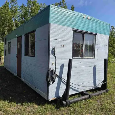 10' x 27' drill rig, skid shack/tiny home. Sits on triple beam skid system. Propane stove and forced...