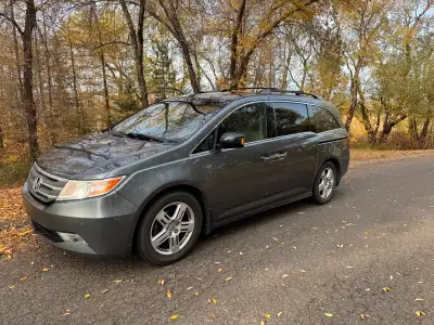 Very well maintained 2012 Honda Odyssey Touring. 8 passenger, leather interior, power sliding doors,...