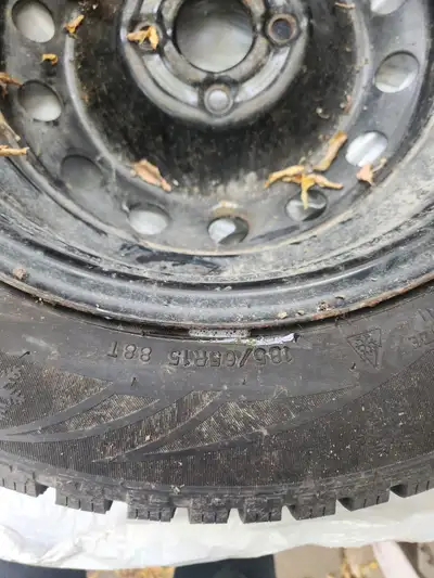 set of 4 185/65 R15 studded tires on rims