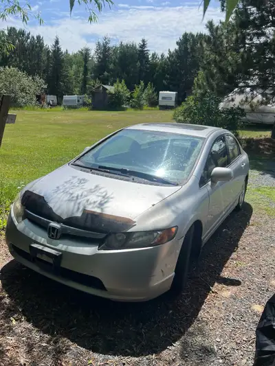 Selling my 2007 Honda civic Lx. Car has 264,000kms on it. Has some rust issues but motor runs great...