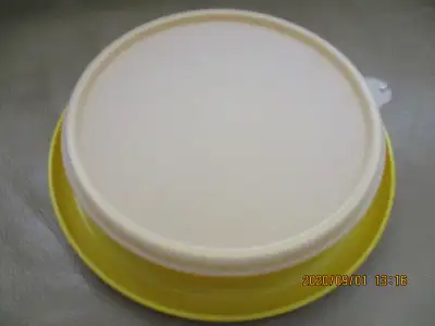 This is a Tupperware Little Diner Bowl for toddlers and young children, number 1317 in sunshiny yell...