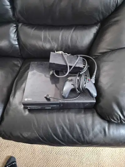 Xbox one older With controller and cords Works great Factory reset