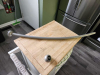 Curved shower rod and shower caddy 