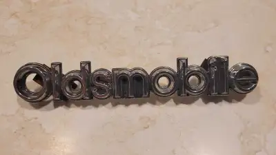 GM part# #22510798. "Oldsmobile" badge intact with both mounting pins and clips. I don't respond to...