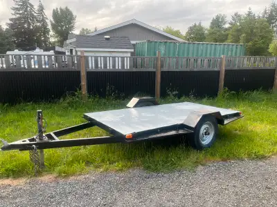 2000 5’x10’ U-built utility trailer, has a steel deck, 6 lug axle, new side marker lights, very soli...