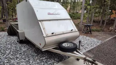 Enclosed, wedge nose 5x12 trailer. Fits single snowmobile (or snowmobile plus snow bike), an atv, or...
