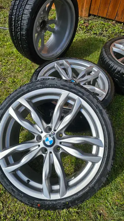 20-inch BMW rims and tires staggered for sale. Rims are used, tires are brand new. Front tires are 2...