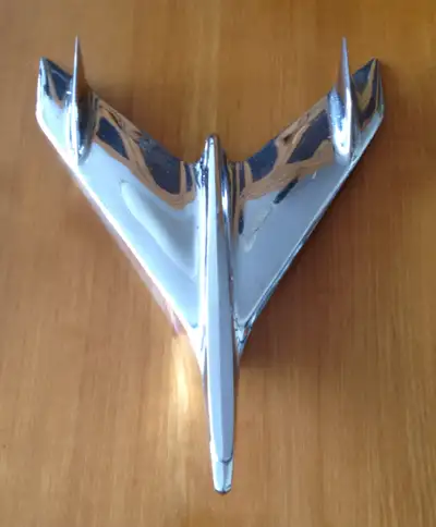 Modeled on the US Navy's Vought F7U Cutlass this chrome hood ornament like the car itself is an all...