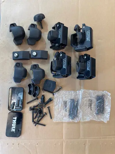 Thule roof rack parts. Like new. Includes new key cylinders.