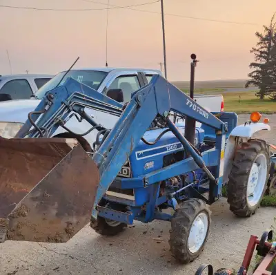13,000 frim Great running diesel yard tractor 4x4 16hp with 3 point hitch front loader Located 10min...