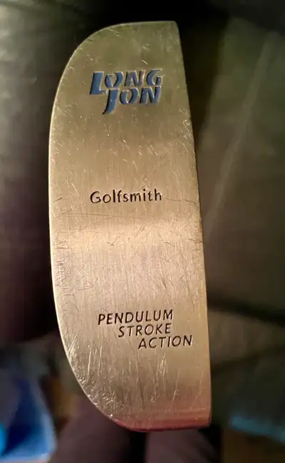 This Golfsmith Long Jon putter is designed for a pendulum stroke action, offering balance and contro...