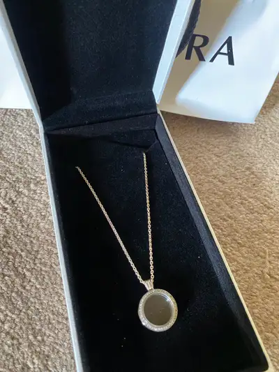 Pandora sparkle floating locket necklace. Brand new. Never worn. Unwanted gift. Comes in box and bag...