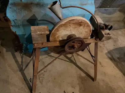 Antique sharpening stone. Approximately 16 inch diameter