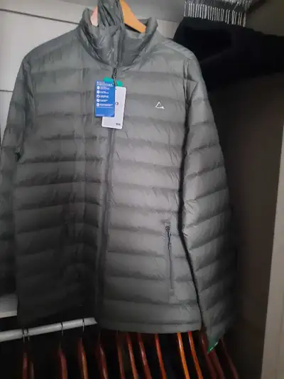 Stay warm and stylish with this new Paradox Grey Down Puffer Jacket in size XL! This jacket is perfe...