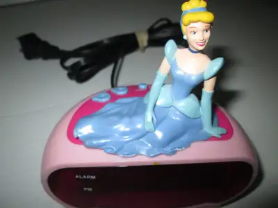 Princess/Cinderella digital alarm clock. Tested and works, Can plug into wall or use batteries. Avai...