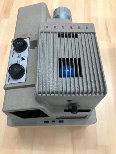 Revere 555 slide projector with case, View more