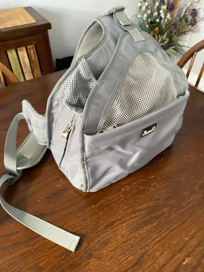 small puppy over shoulder carrier, View more