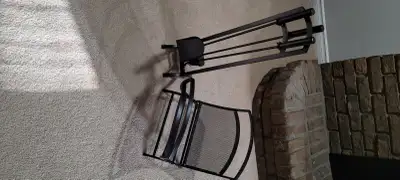 Black wrought iron fireplace tool set with log holder. In excellent condition.