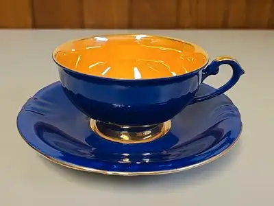 The Winterling Bavaria Germany Tea Cup and Saucer set features a stunning combination of cobalt blue...