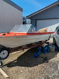 Boat and motor and trailer