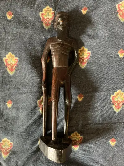 Stands 12 inches tall and made of wood I live near the Dundas West station