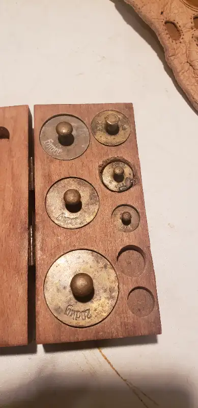 These brass weights were manufactured and used in western Europe more than 100 years ago to weigh fo...