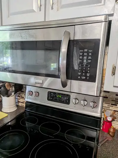 Appliance installer to install range over microwave, View more