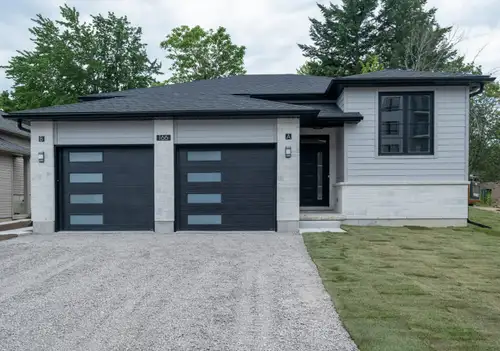 Brand New Two-Bedroom Lower-Level Apartment with Private Entrance, Direct Garage Access and Green Sp...