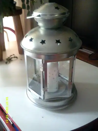 metal and glass lantern 16" tall will include candle pick up Hastings
