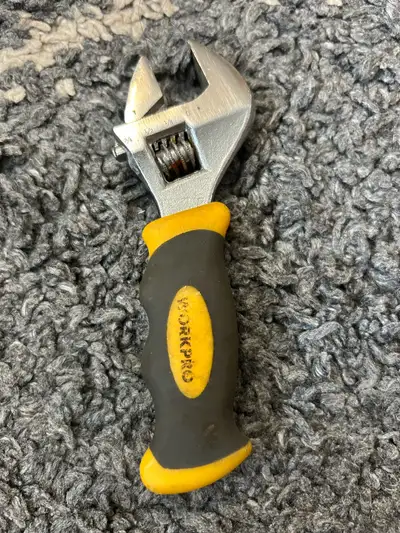 This Workpro adjustable wrench is perfect for various tasks, with a maximum jaw opening of 1 1/8". A...