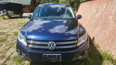 The 2014 Volkswagen Tiguan is a compact SUV with a turbocharged four-cylinder engine, all-wheel driv...