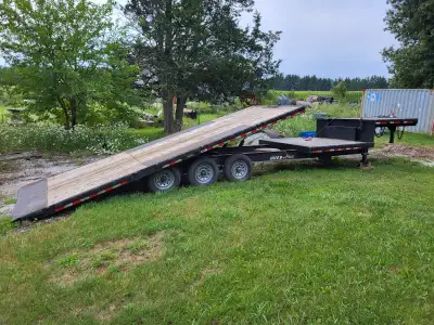 2017, 38' flatbed, first 22 feet is tilt deck, then 8 more feet is fixed, then 8' deck on neck. Thre...