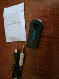 Bluetooth adapter for auxiliary output. Brand new. Handsfree mic