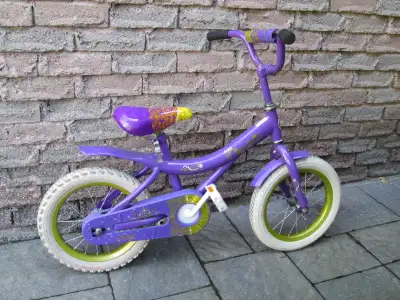 14" bike with white tires and pedals and gold rims. Safety chain guard and crossbar padding. Fenders...