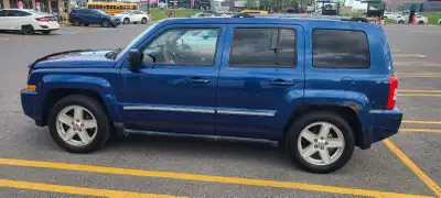 The 2010 Jeep Patriot a compact, front-engine crossover SUV featuring a signature, boxy Jeep exterio...